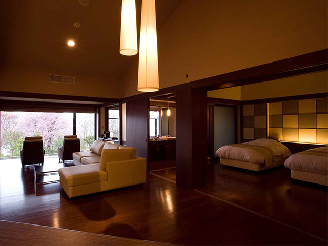 客房設計不做過多贅飾，以木質地板延續水之謌一貫的溫潤感。